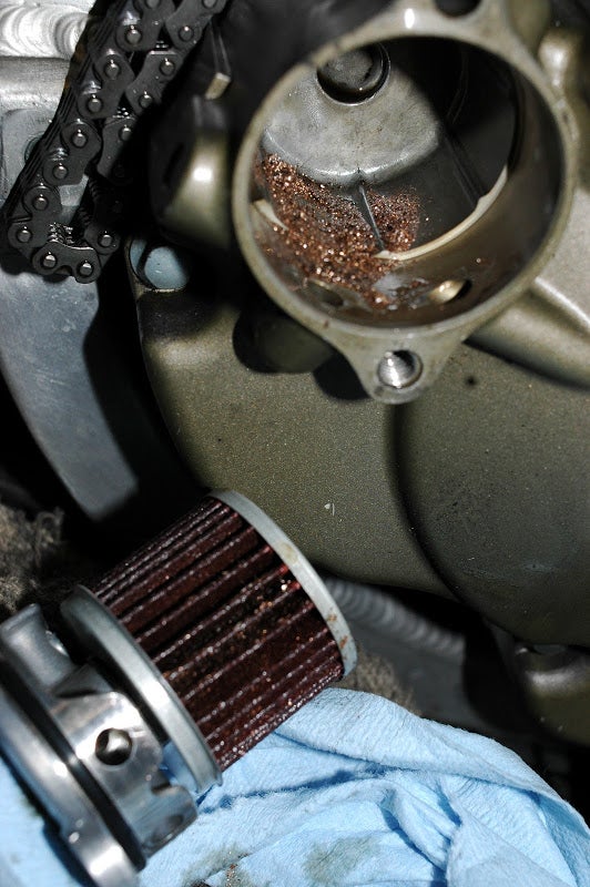 Gold flakes in oil CRF250R & RX ThumperTalk